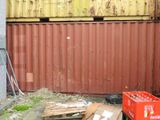 a crate of coke sitting in front of a building