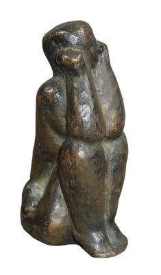 statue of a man sitting on his knees with his head in his hands
