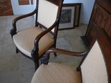two chairs that are sitting next to each other