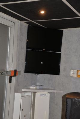 a television mounted on the wall in a room