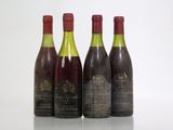 three bottles of wine are lined up on a table