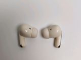 pair of airpods sitting on top of a white surface