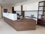 a picture of a reception desk in a large office