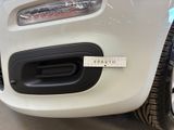 a close up of a white car with a sticker on it ' s bumper