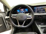 the interior of a car with a steering wheel, dashboard, and dashboard controls