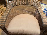 an image of a wicker chair sitting on top of a hard wood floor