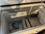 a cooler that is sitting inside of a room
