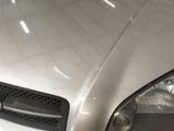 a close up of a car ' s headlight and front bumper