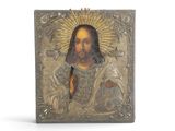 an image of a metal plaque with a picture of jesus on it