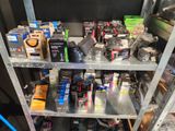many different items on the shelves in the room