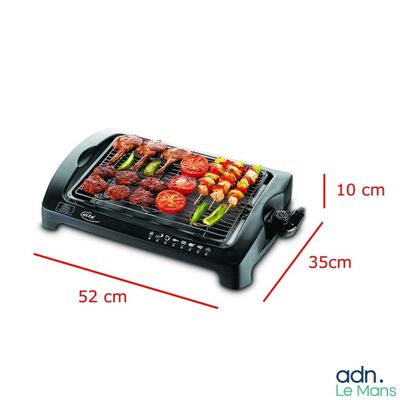une photo d'un grand barbecue sur lequel sont disposés des légumes et de la viande