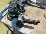 some tools are sitting on top of a table in a room