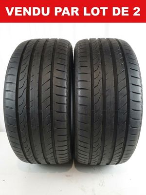 a pair of tires on a white background with the words vendu par lot de 2