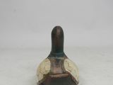 a small vase that is sitting on a white surface