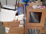 a pile of boxes and bags on a pallet in a warehouse