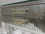 a mirrored table with a drawer on top of it