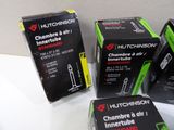 four boxes of different types of cigarettes on a white surface