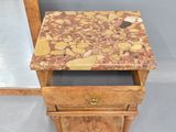 a small table with a marble top and a drawer underneath it