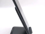 a cell phone that is sitting on top of a stand