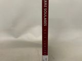 a close up of a book on a white surface with a white background