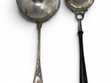 two spoons that are sitting next to each other
