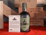 a bottle of liquor sitting next to a wooden box