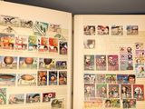 an open book with a bunch of stamps on it