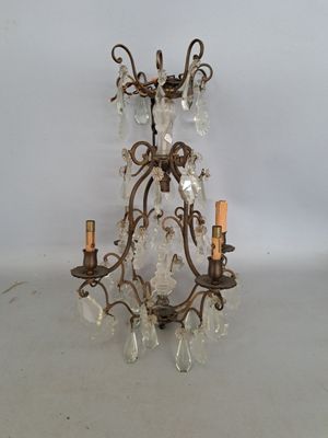 an image of a chandelier with crystal beads hanging from it ' s arms