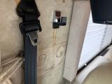 a seat belt attached to the back of a bus