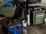 an image of a workbench in a garage with a lot of tools