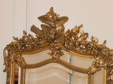 a mirror that is sitting on the wall in the room