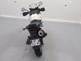a black and white motorcycle parked in a room