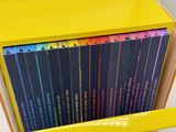 a lot of books in a yellow box on a shelf