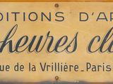 yellow sign with black writing on it that says editions d ' art les heures claire