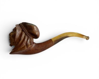 une image représentant une pipe surmontée d'une tête d'homme