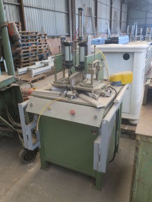 a machine that is sitting in a warehouse with other machines