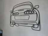 a picture of a metal wall art of a car
