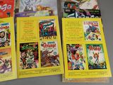 a lot of comic books sitting on a table