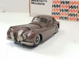 a toy car sitting on a table next to a box