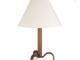 a wooden table lamp with a white shade on top of it