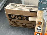 a box of tools sitting on a table next to a pair of scissors