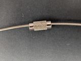 a close up of a silver bracelet with a diamond clasp