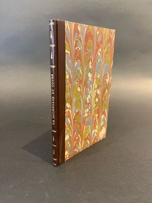 a book with a brown cover sitting on top of a table