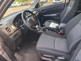 the interior of a car with a steering wheel and a dashboard