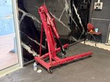 a red crane that is sitting in a room