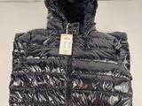a close up of a black puffer jacket with a hood