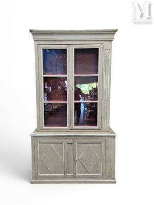 an image of a white china cabinet with a glass door