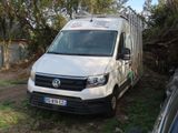 a white van that is parked in the grass