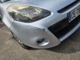 a silver car that is parked in a parking lot