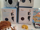 a stuffed animal sitting on a table next to a box of toys